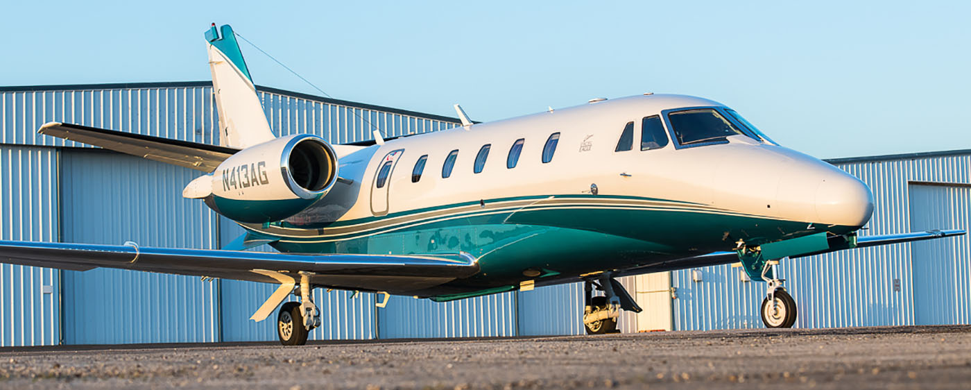 White and Teal Jet Aircraft